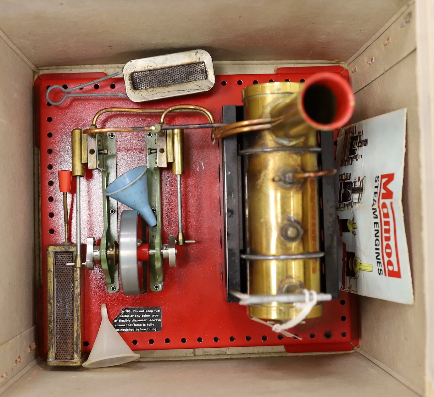 A Mamod steam engine, single cylinder with 6.5cm flywheel, in original box